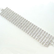 7266 $34 Austrian  9 rows crystals in silver, gapped  with metal clasp