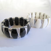 7285 $36 White lucite silver with crystal stretch 1in W